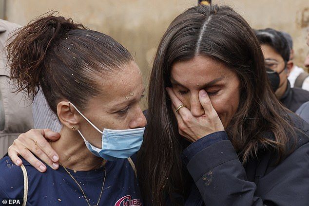 Queen Letizia of Spain sheds a tear as she meets relatives of Valencia flash flood victims - as she and King Felipe are heckled by crowds | Daily Mail Online