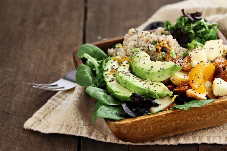 Quinoa, avocado and apple salad. Perfect for the detox diet or just a healthy meal. Selective focus with extreme shallow depth of field.