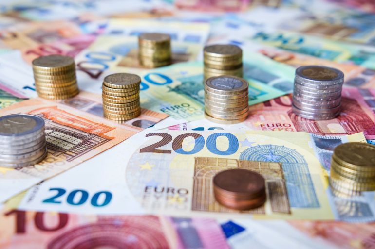 A combination of different Euro banknotes and Euro coins as a closeup