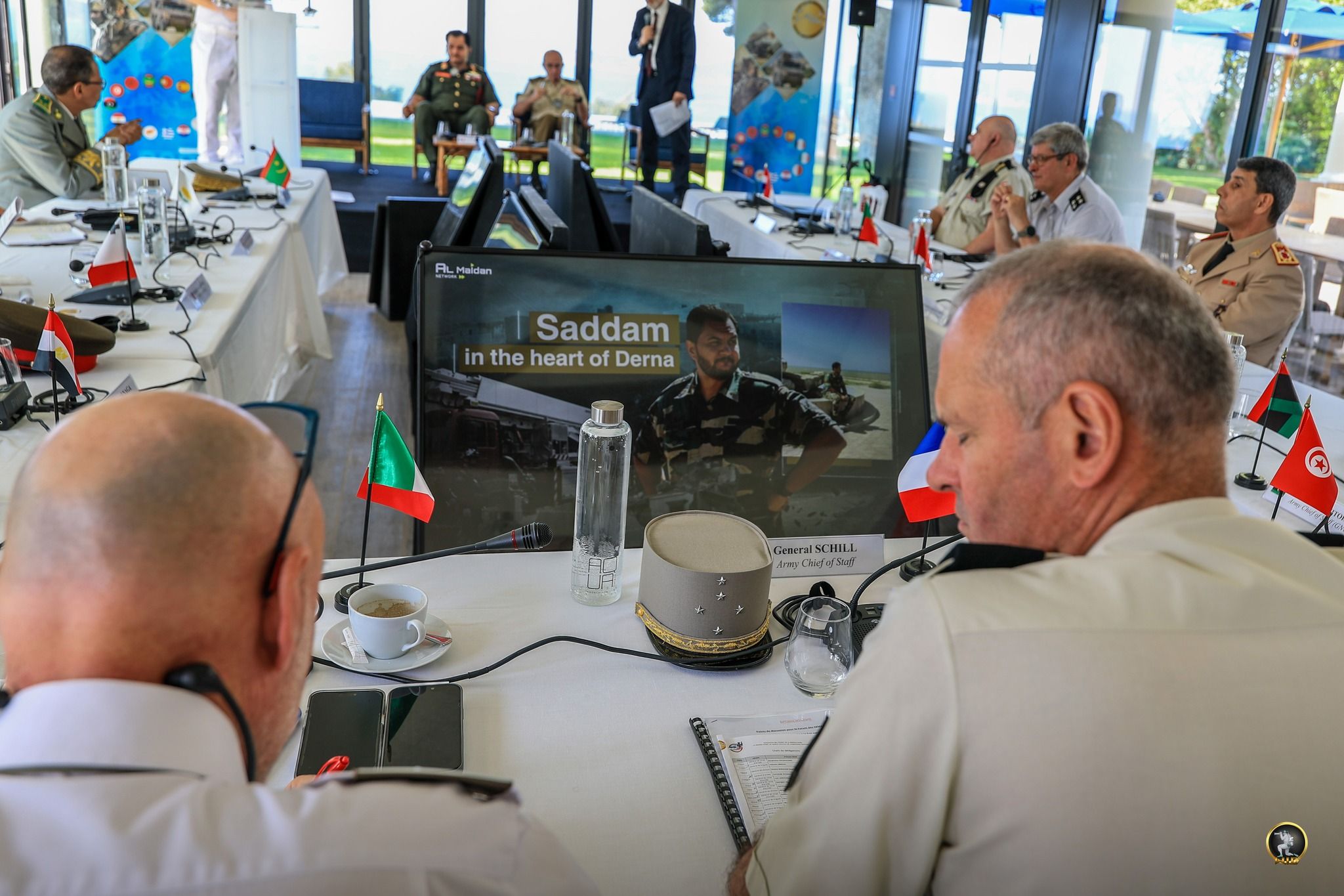 May be an image of 13 people, helicopter and text that says 'PL Maidan Saddam intheheartofDerna in the heart of Derna Geaer ceralSCHILL มิอ'วิต์'