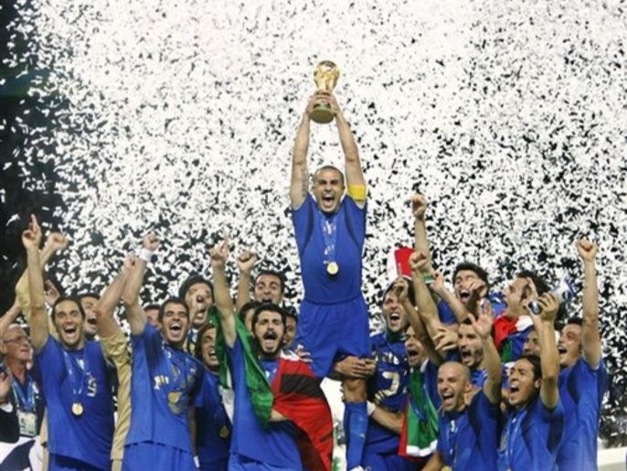In this Sunday, July 9, 2006 file photo Italy's Fabio Cannavaro lifts the trophy after defeating France 5-3 in a penalty shootout in the final of the soccer World Cup between Italy and France, in the Olympic Stadium in Berlin. The champions of the world may have a tougher time becoming champions of Europe. Italy is among the top teams at the 2008 European Championship, but the motivation which drove the Azzurri to the World Cup title two years ago is long gone.
