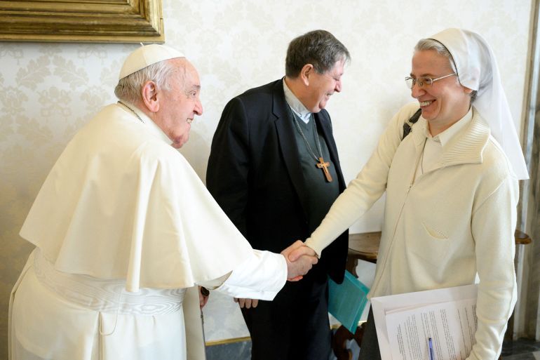Sister Simona Brambilla, 59, who became the first woman named by Pope Francis to lead a major Vatican department on January 6, 2025, shakes hand with Pope Francis in this undated picture released by Vatican Media/Handout via REUTERS ATTENTION EDITORS - THIS IMAGE WAS PROVIDED BY A THIRD PARTY