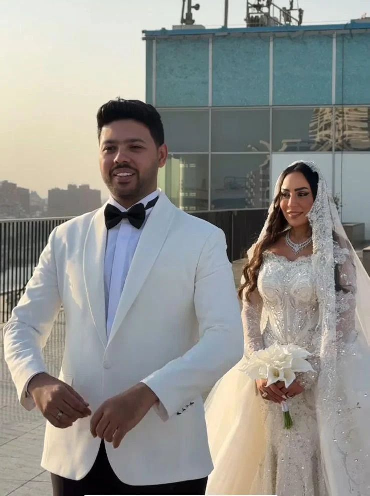 May be an image of 2 people, suit and wedding