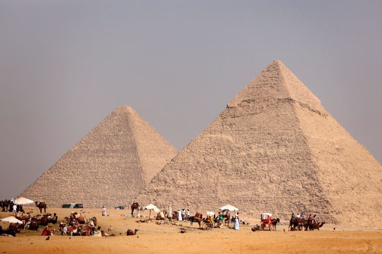 Tourists gather at the Pyramids of Giza, on the outskirts of Cairo, Egypt, October 26, 2023. REUTERS/Mohamed Abd El Ghany REFILE - CORRECTING YEAR FROM