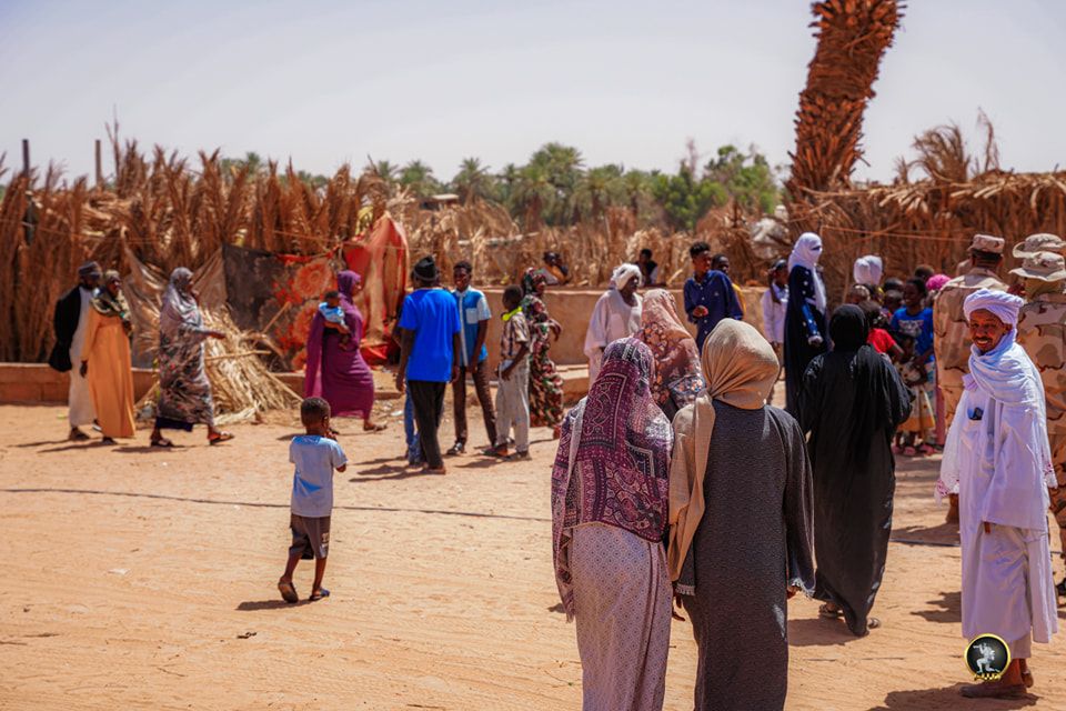 May be an image of 6 people, camel and text