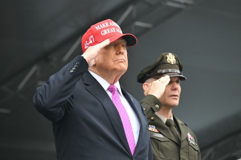 US President Donald Trump and US Military Academy Superintendent Lt. Gen. Steven Gilland listen to the national anthem before Trump delivers the commencement address at the 2025 graduation ceremony at the US Military Academy West Point on May 24, 2025, in West Point, New York. (Photo by SAUL LOEB / AFP)