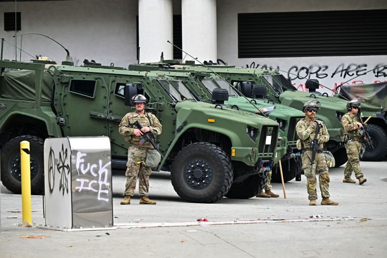 Members of the National Guard stand guard outside the Metropolitan Detention Center, MDC in downtown Los Angeles, California on June 8, 2025.