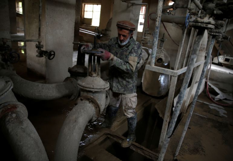 Dadullah, an employee at the Jabal Saraj cement factory, works at a plant in Jabal Saraj, north of Kabul, Afghanistan April 19, 2016. In an area desperately short of industry and jobs, local workers hope that the relaunch of the plant in Jabal Saraj, built by Czech engineers in 1957 and closed down by the Taliban in 1995, can show that Afghanistan's shattered industry can climb back to its feet after decades of war and destruction. But the outdated state-owned plant some 75 kilometres outside Kabul also shows how far it has to go before that promise can be achieved and there are serious questions over whether it has a viable future unless a new, modern facility is built to replace it. REUTERS/Ahmad Masood SEARCH