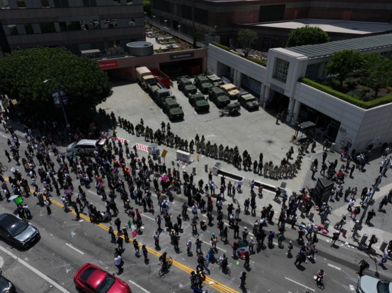 LOS ANGELES, CALIFORNIA - JUNE 8: ICE officers and national guards confront with protesters outside of the Metropolitan Detention Center in Los Angeles, California on June 8, 2025 amid protests over immigration raids. (Photo by Tayfun Coskun/Anadolu via Getty Images)