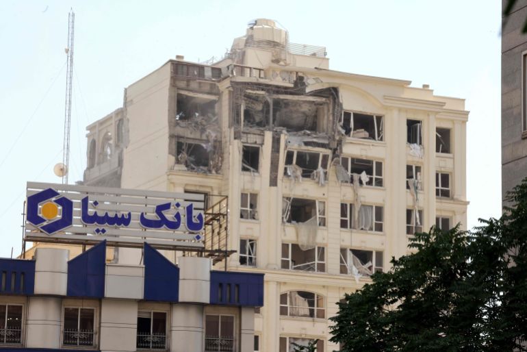 CORRECTION / This picture shows a building damaged in an Israeli strike on Tehran on June 13, 2025. Israel hit about 100 targets in Iran on June 13, including nuclear facilities and military command centres and killing senior figures including the armed forces chief and top nuclear scientists. (Photo by Atta KENARE / AFP) / The erroneous mention[s] appearing in the metadata of this photo by MEGHDAD MADADI has been modified in AFP systems in the following manner: [Atta KENARE] instead of [Meghdad MADADI]. Please immediately remove the erroneous mention[s] from all your online services and delete it (them) from your servers. If you have been authorized by AFP to distribute it (them) to third parties, please ensure that the same actions are carried out by them. Failure to promptly comply with these instructions will entail liability on your part for any continued or post notification usage. Therefore we thank you very much for all your attention and prompt action. We are sorry for the inconvenience this notification may cause and remain at your disposal for any further information you may require.