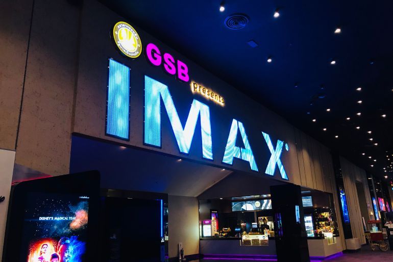 Bangkok, Thailand - May 18, 2019 : IMAX ICON CINECONIC at ICONSIAM mall.Notice of IMAX theatre at store.People go to see movie at night.; Shutterstock ID 1402742117; purchase_order: aljazeera ; job: ; client: ; other: