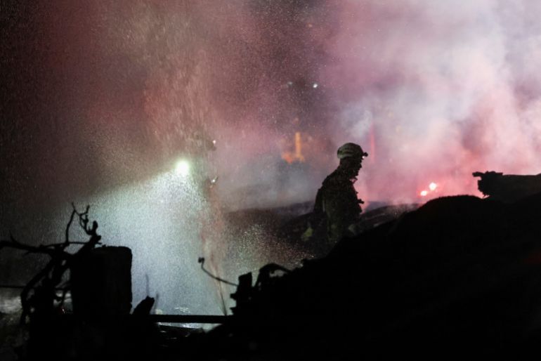 Emergency personnel operate after missiles were launched from Iran to Israel, in Haifa, Israel, June 15, 2025. REUTERS/Shir Torem