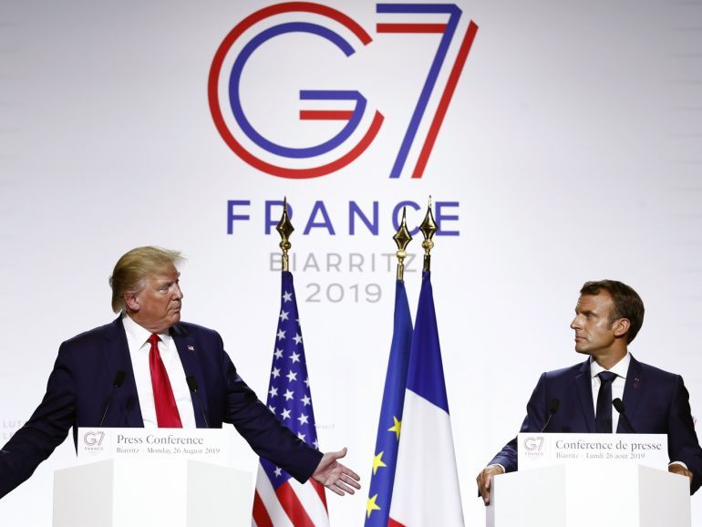 epa07795397 French President Emmanuel Macron (R) and US President Donald J. Trump (L) hold a press conference on the closing day of the G7 summit in Biarritz, France, 26 August 2019. EPA-EFE/IAN LANGSDON