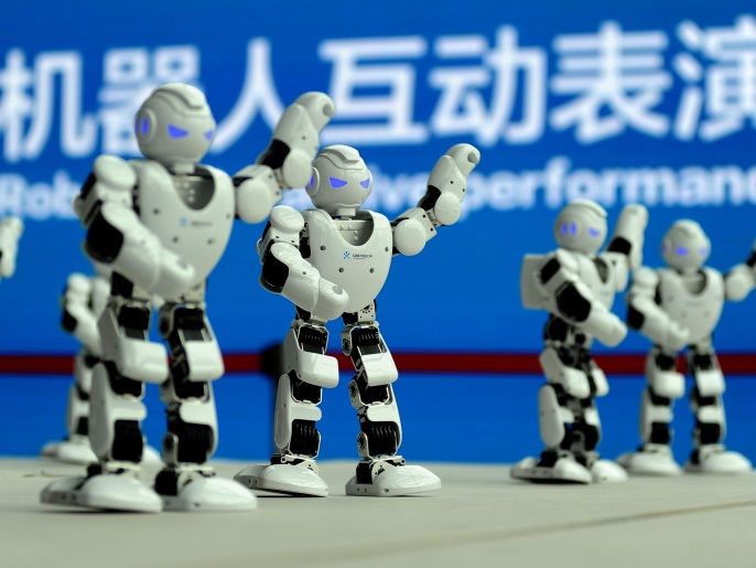 Humanoid robots developed by UBTECH perform a synchronised dance at the World Intelligent Manufacturing Summit in Nanjing, Jiangsu province, China December 7, 2017. REUTERS/Stringer ATTENTION EDITORS - THIS IMAGE WAS PROVIDED BY A THIRD PARTY. CHINA OUT.