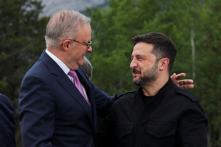 Australian Prime Minister Anthony Albanese embraces Ukraine's President Volodymyr Zelenskiy as they pose for a photo during the G7 Leaders' Summit in Kananaskis, in Alberta, Canada, June 17, 2025. REUTERS/Amber Bracken