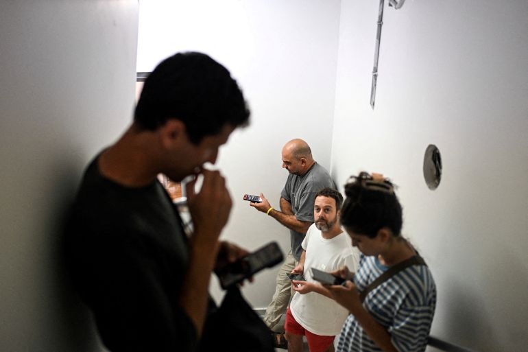 Israelis take cover in a public shelter during a missile attack on Israel from Iran, at Haifa, Israel, June 14, 2025. REUTERS/Rami Shlush ISRAEL OUT. NO COMMERCIAL OR EDITORIAL SALES IN ISRAEL