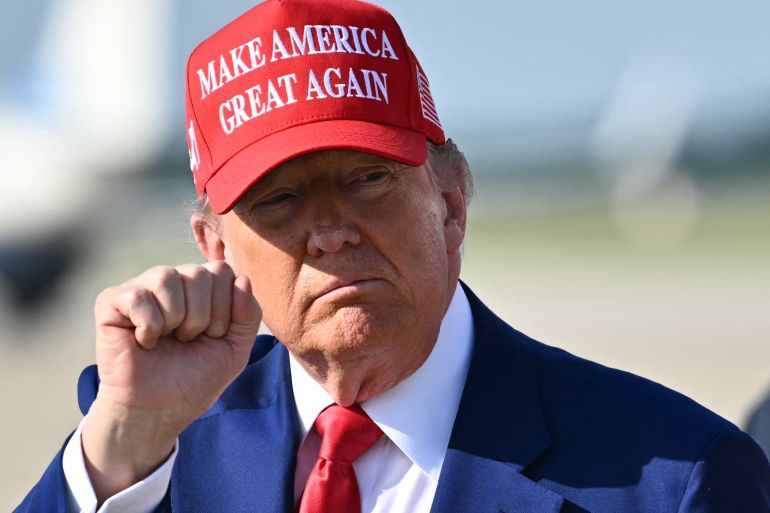 US President Donald Trump pumps his fist after stepping off Air Force One at Joint Base Andrews in Maryland on June 21, 2025 upon return from his golf club in Bedminster, New Jersey. (Photo by Mandel NGAN / AFP)