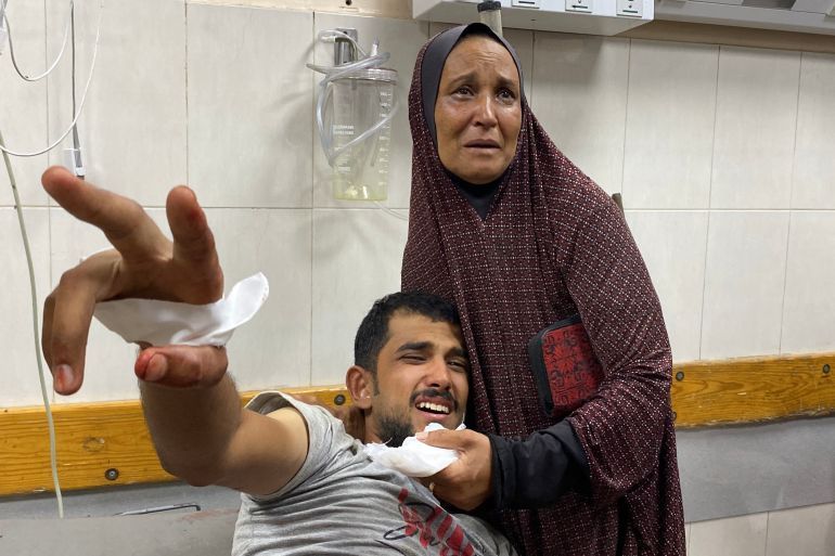 A wounded Palestinian man awaits medical attention at Khan Yunis' Nasser hospital in the southern Gaza Strip on June 19, 2025.