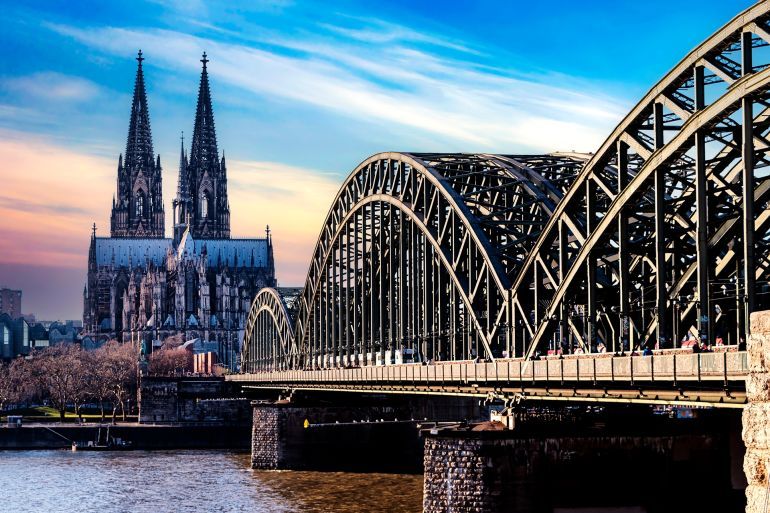 Cologne (Koln) in North Rhine Westphalia region of Germany, Cologne Cathedral and Hohenzollern Bridge over the Rhine River.