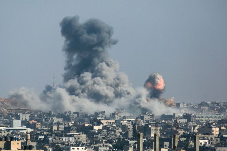 A column of fire and smoke erupts following Israeli bombardment of areas east of the Tuffah neighbourhood in eastern Gaza City on June 18, 2025. (Photo by Bashar TALEB / AFP)