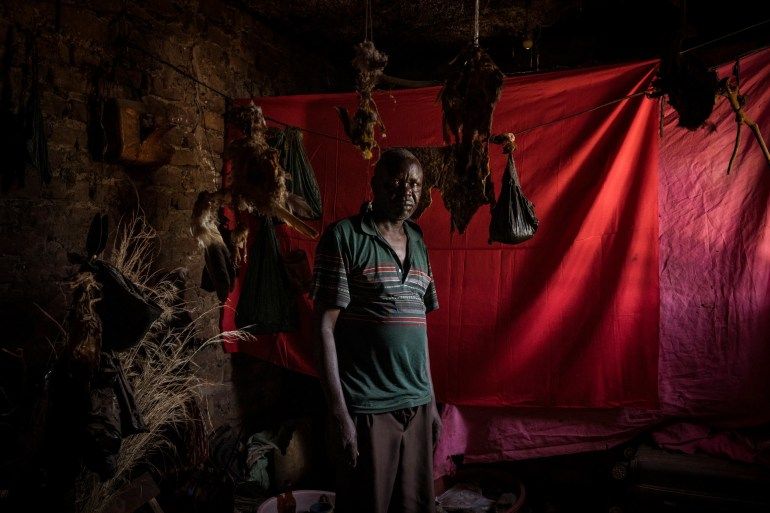 Witch doctors like Robert Apedu in Soroti District provide 77 percent of health services in rural areas. They offer a more convenient alternative to health facilities and medicines found in cities [Christopher Hopkins/Al Jazeera]