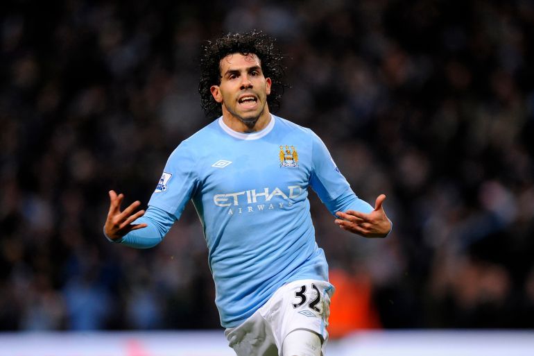 Carlos Tevez of Manchester City celebrates after scoring to make it 1-1 (Photo by AMA/Corbis via Getty Images)