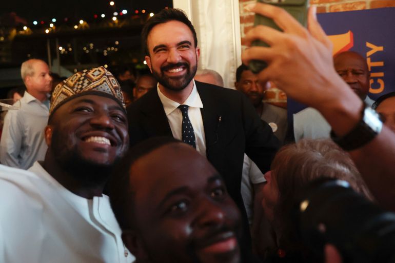 Democratic mayoral candidate Zohran Mamdani takes selfies with supporters after speaking at his primary election party, Wednesday, June 25, 2025, in New York. (AP Photo/Heather Khalifa)
