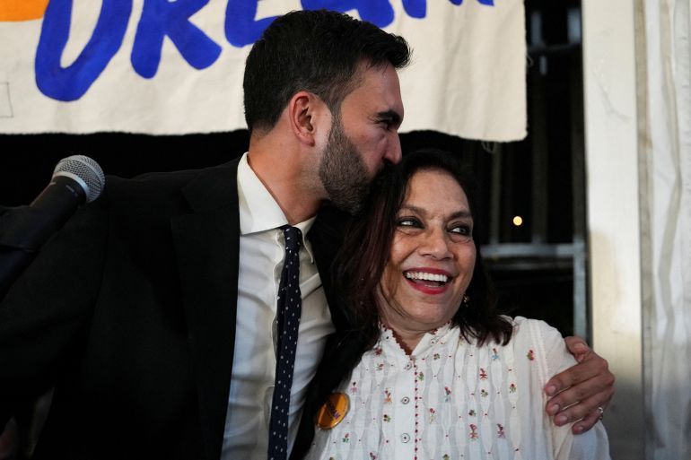 Zohran Mamdani kisses his mother Mira Nair during a watch party for his primary election, which includes his bid to become the Democratic candidate for New York City mayor in the upcoming November 2025 election, in New York City, U.S., June 25, 2025. REUTERS/David 'Dee' Delgado