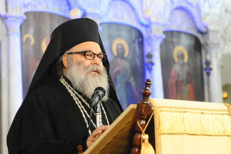 Patriarch John X Yazigi, Greek Orthodox Patriarch of Antioch and All the East, delivers a speech at a ceremony to pray for peace in a country plagued by two and a half years of war, during a Christmas mass at al-Maryamyeh church in Damascus December 25, 2013, in this handout photograph released by Syria's national news agency SANA. REUTERS/SANA/Handout via Reuters (SYRIA - Tags: POLITICS RELIGION ANNIVERSARY) ATTENTION EDITORS – THIS IMAGE WAS PROVIDED BY A THIRD PARTY. FOR EDITORIAL USE ONLY. NOT FOR SALE FOR MARKETING OR ADVERTISING CAMPAIGNS. THIS PICTURE IS DISTRIBUTED EXACTLY AS RECEIVED BY REUTERS, AS A SERVICE TO CLIENTS