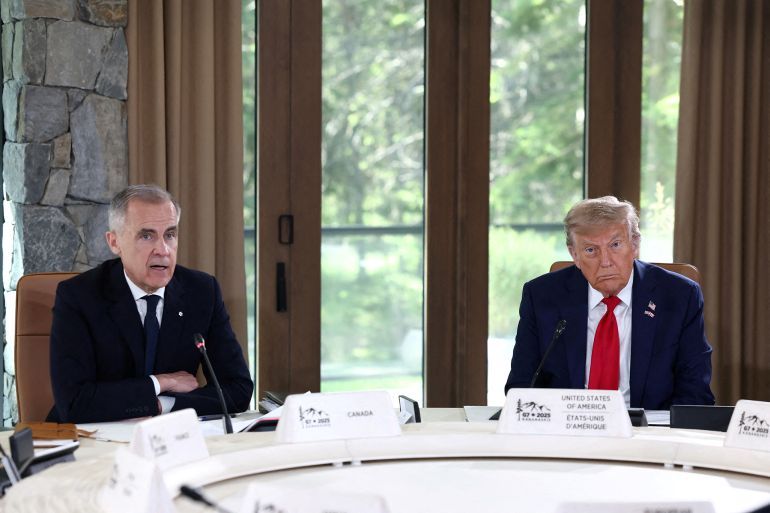 U.S. President Donald Trump and Canadian Prime Minister Mark Carney attend a meeting with G7 leaders and guests, at the G7 summit in Kananaskis, Alberta, Canada, June 16, 2025. REUTERS/Kevin Lamarque REFILE - CORRECTING ID FROM