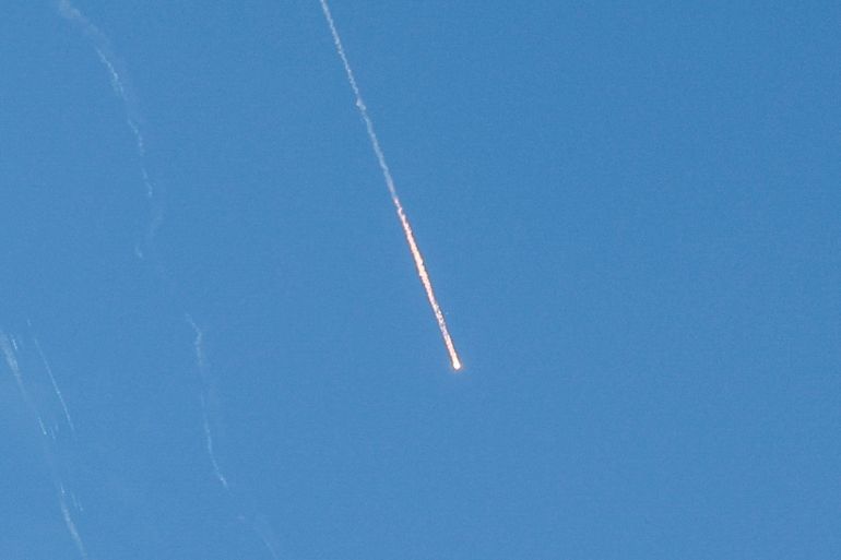 Missiles launched from Iran towards Israel are seen from Tubas, in the Israeli-occupied West Bank, June 22, 2025. REUTERS/Raneen Sawafta