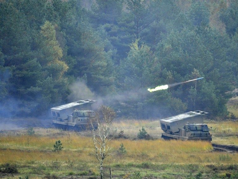 MUNSTER, GERMANY - OCTOBER 10: Two Mars rocket launcher tanks of the Bundeswehr, the German armed forces, during a simulated attack during military exercises on October 10, 20187 near Munster, Germany. Today's exercises, dubbed