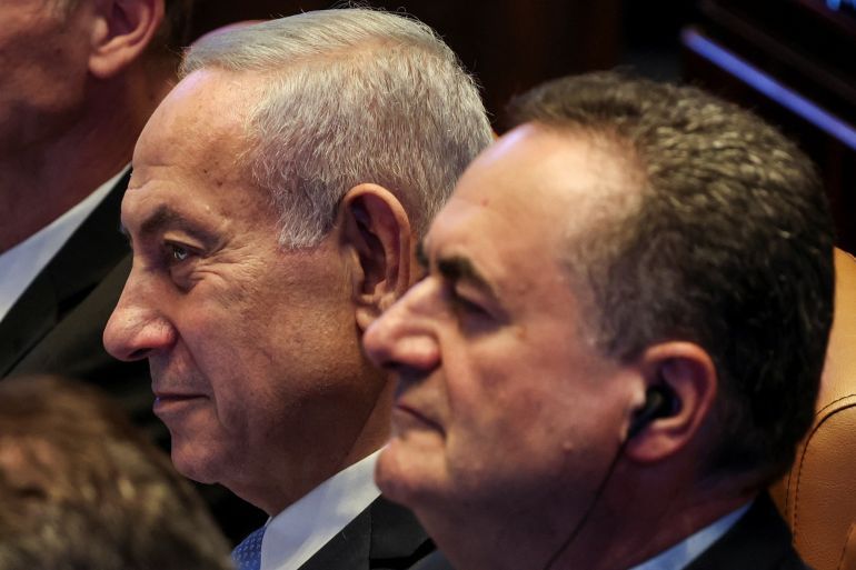 Israeli Prime Minister Benjamin Netanyahu and Foreign Minister Israel Katz attend a Plenum session of the Knesset, Israel's Parliament, in Jerusalem, June 11, 2025 REUTERS/Ronen Zvulun