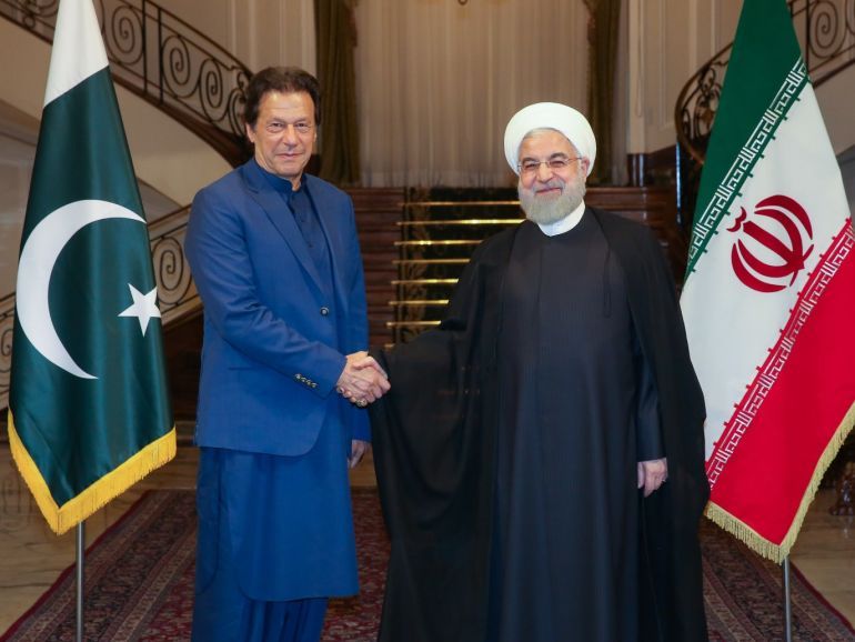epa07917399 A handout photo made available by the presidential office shows Iranian President Hassan Rouhani (R) receiving Pakistani Prime Minister Imran Khan (L) at presidential palace in Tehran, Iran, 13 October 2019. Media reported that Imran Khan is in Tehran to meet with Iranian officials. EPA-EFE/PRESIDENT OFFICE HANDOUT HANDOUT EDITORIAL USE ONLY/NO SALES