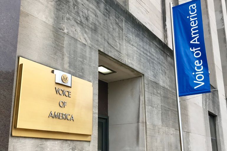WASHINGTON, DC - JANUARY 12, 2019: VOICE OF AMERICA headquarters building entrance with sign. VOA is an international broadcaster funded by the US Congress.