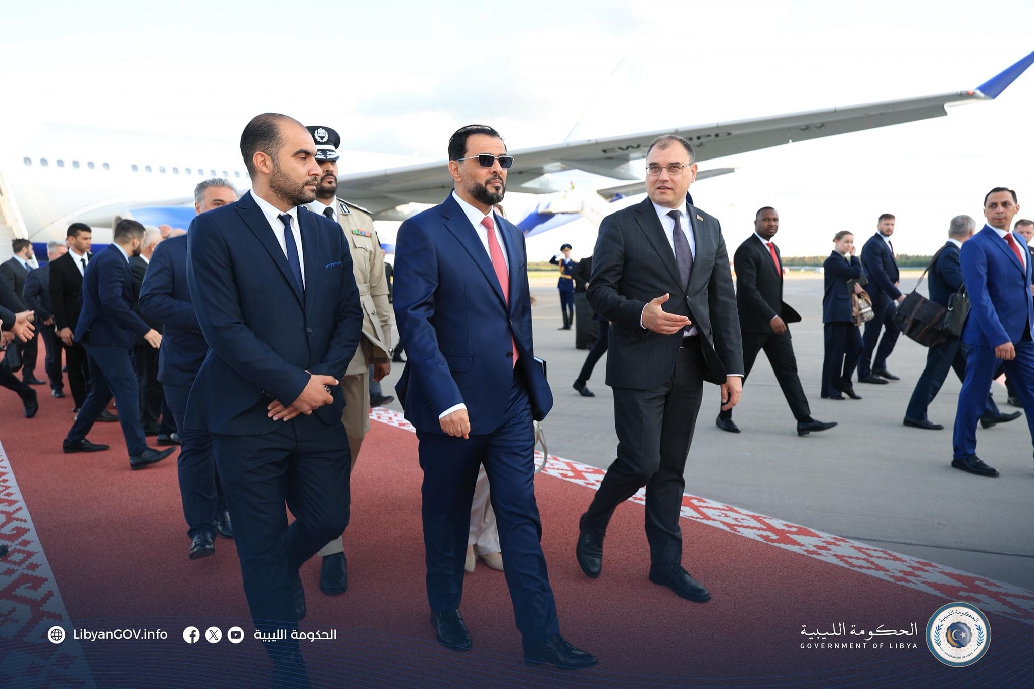 May be an image of ‎11 people, aircraft and ‎text that says '‎.··... + LibyanCOV.info f الليبية الحكومة 1มม 2 الليية الحكومة_اللييية مة الحكومة COVERNMENTOFLIB DF‎'‎‎