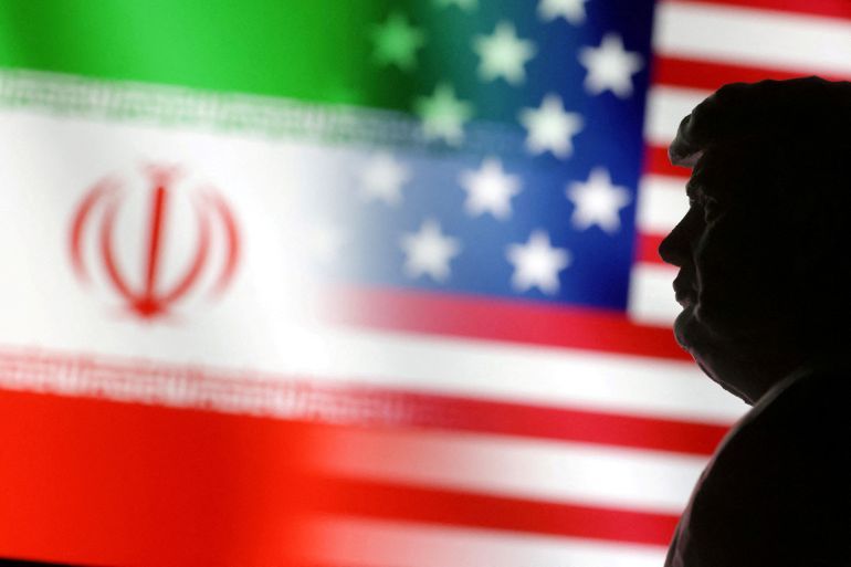 FILE PHOTO: A 3D-printed miniature model of U.S. President Donald Trump and the U.S. and Iran flags are seen in this illustration taken January 15, 2025. REUTERS/Dado Ruvic/Illustration/File Photo