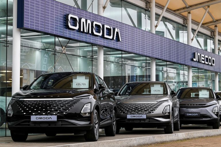 Models of the Chery Omoda 5 and Chery Omoda E5 on display at Stoner Motor Company which specialises in the Chinese car company in Gillingham, Britain, November 6, 2024. REUTERS/Chris J. Ratcliffe To?Match?Special?Report CHINA-AUTOS/SPEED