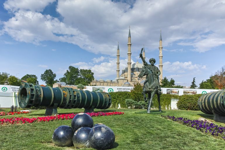 EDIRNE, TURKEY - MAY 26, 2018: Selimiye Mosque and monument of Ottoman Sultan Mehmed II with medieval cannon in city of Edirne, East Thrace, Turkey