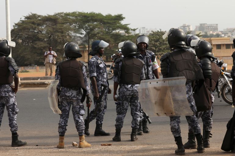 Riot police officers stand guard as they try to stop protesters from gathering in front of the College Saint Joseph in Lome, Togo February 28, 2020. REUTERS/Luc Gnago