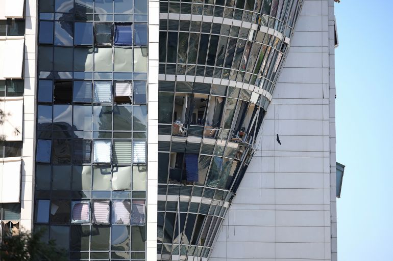 A view shows a damaged building, following Iran's missile strike on Israel, amid the Iran-Israel conflict, in Haifa, Israel, June 20, 2025. REUTERS/Florion Goga