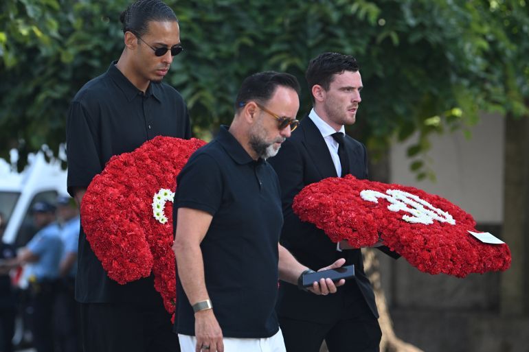 PORTO, PORTUGAL - JULY 05: Liverpool's Dutch defender Virgil van Dijk (L) and Liverpool's Scottish defender Andy Robertson (R) arrive for the funeral of Liverpool's Portuguese forward Diogo Jota and his brother Andre Silva in Gondomar, on the outskirts of Porto, on July 5, 2025. Liverpool forward Diogo Jota and his brother died in a car crash in Spain on July 3, 2025, sparking widespread grief just after the Portugal star had got married. (Photo by Alex Juarez/Anadolu via Getty Images)