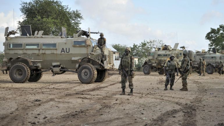 In this photo taken Sunday, Aug. 31, 2014 and provided by the African Union Mission to Somalia (AMISOM) Monday, Sept. 1, 2014, African Union (AU) soldiers from Uganda gather in the town of Kurtunwarey in Somalia. Somali government and AU troops have been engaging al-Shabab militants as part of their military offensive dubbed