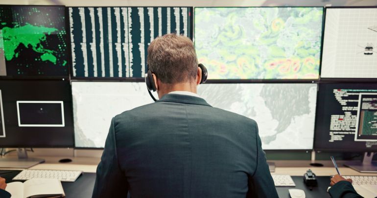 Headset, back or man with screen for maps for news, research or ecology in data center. Pattern, check or computer for tracking technology for meteorology info, storm radar or climate change forecast