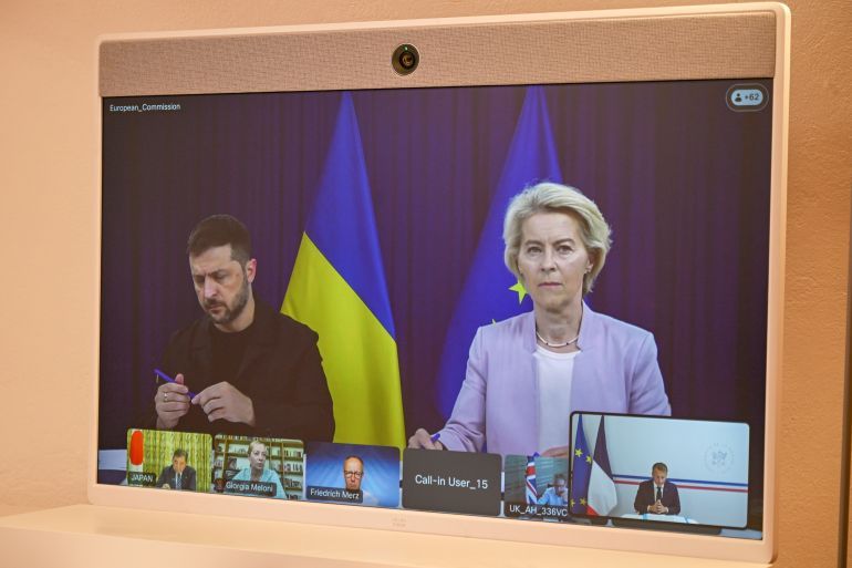 European Commission Ursula van der Leyen and Ukraine's President Volodymyr Zelenskyy appear on a screen during a video conference with French President Emmanuel Macron as part of the so-called 