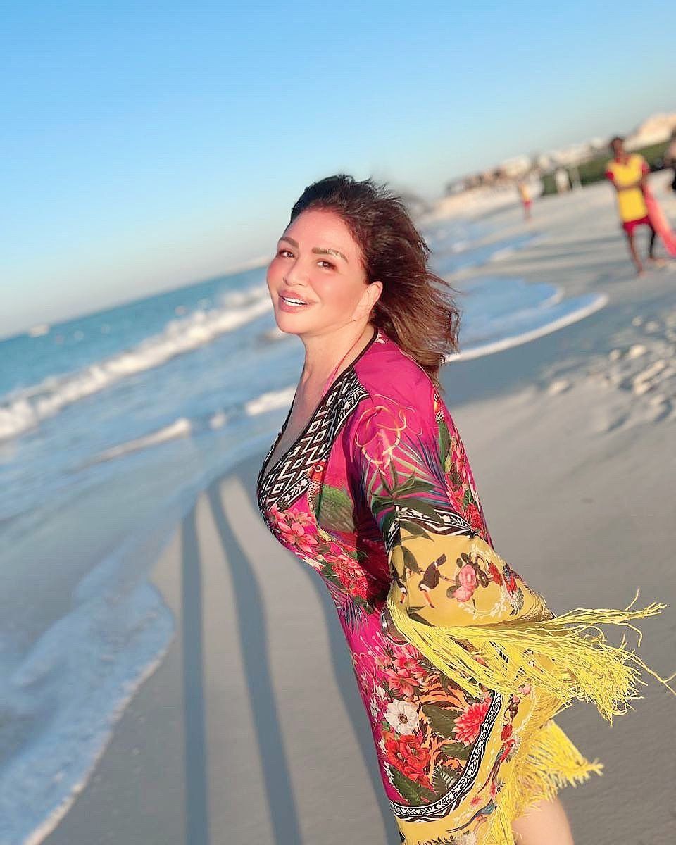 May be an image of 2 people, beach and ocean