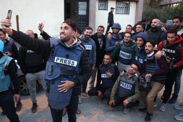 Moaz Abu Taha, a Palestinian journalist who had worked with some Palestinian and international outlets, takes a selfie with fellow journalists in Khan Yunis in the southern Gaza Strip on January 18, 2025. The Foreign Press Association on August 25, called for an