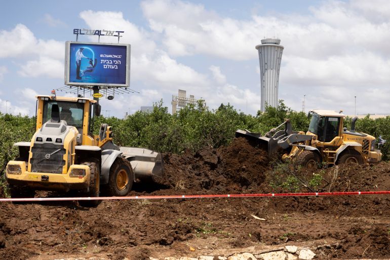 TEL AVIV, ISRAEL - MAY 4: Tractors work at a scene after a ballistic missile fired from Yemen by the Houthi struck a field near Israel's International airport Ben Grunion on May 4, 2025 in Tel Aviv, Israel. Israeli officials have said that a ballistic missile which landed close to the country's main international airport on Sunday was fired by the Iran-backed Houthi rebel group in Yemen. Eight people were injured, according to emergency services, and air traffic at Ben Gurion Airport was temporarily halted. The Houthis, who have escalated a campaign against Israel in opposition to the blockade of aid to Gaza, confirmed the attack in a televised statement. (Photo by Amir Levy/Getty Images)