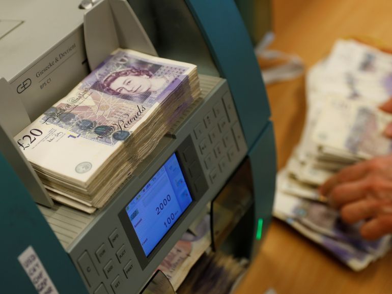 British Pound Sterling banknotes are seen in a counter machine at the Money Service Austria company's headquarters in Vienna, Austria, November 16, 2017. REUTERS/Leonhard Foeger
