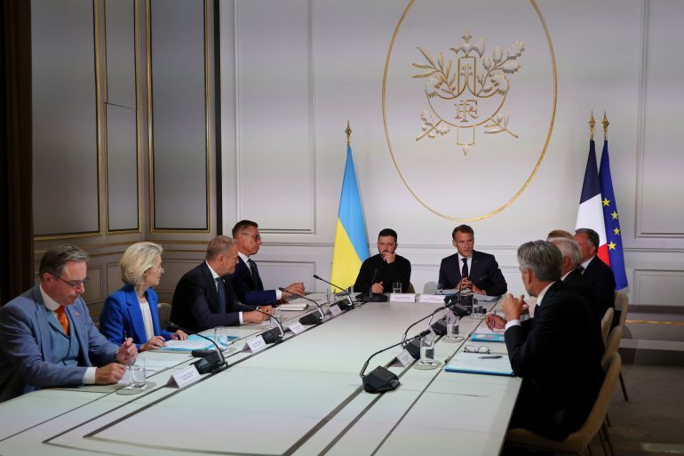 From left, Belgium's Prime Minister Bart De Wever, European Commission President Ursula von der Leyen, Poland's Prime Minister Donald Tusk, Finland's President Alexander Stubb, Ukraine's President Volodymyr Zelenskyy and French President Emmanuel Macron speak during a summit on Ukraine at the Elysee Palace, in Paris, France, Thursday, Sept. 4, 2025. (Ludovic Marin/Pool Photo via AP)